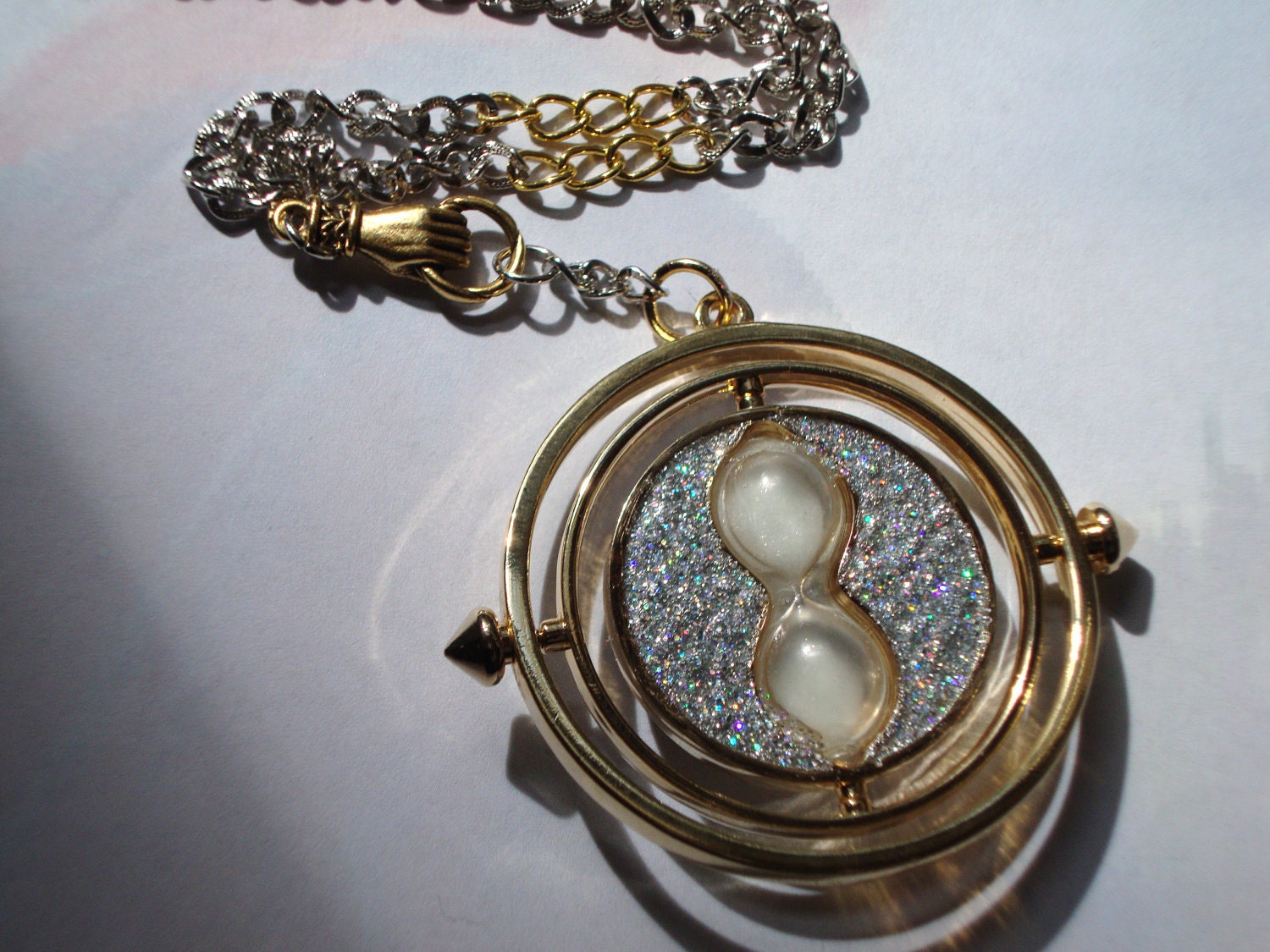 Harry Potter a Time Turner in Hand Necklace , Silver & Gold with Personalized Parchment Note (silver sparkly)