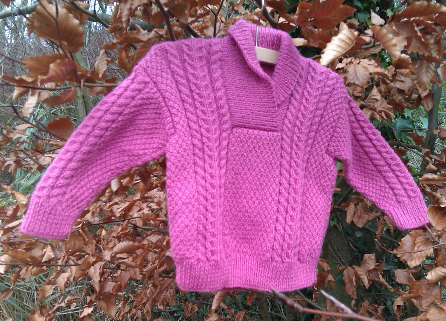 Girl's pink cable sweater