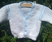 Baby's white and blue trimmed cardigan
