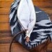 T R A V E L collection Leather and cotton clutch, cream color