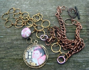 Audrey Hepburn Pendant Necklace gold leafed 24 karat/ Lamp Work .solid copper clasp.Initial H picture OF Audrey Hapburn