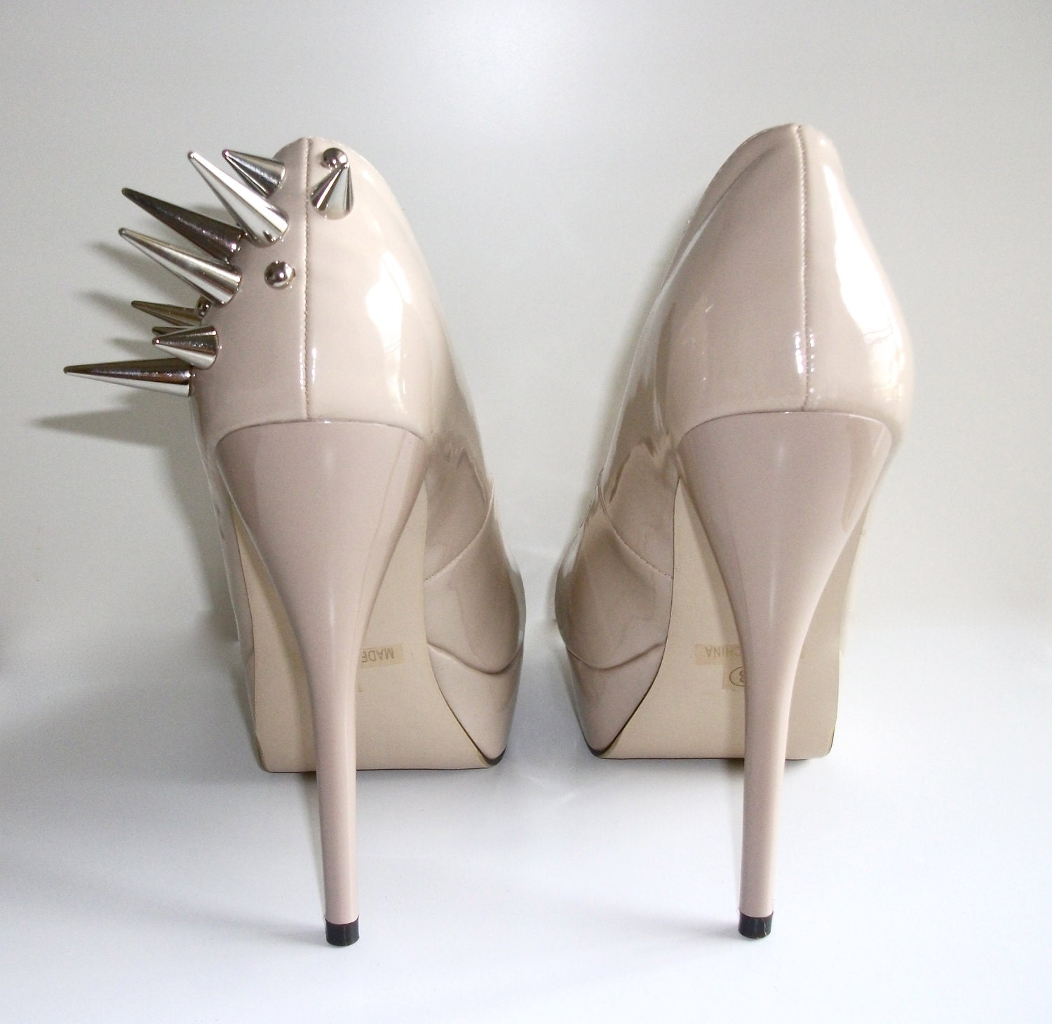 Asymmetrical Spiked Patent Leather Pumps - Nude