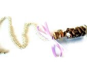 Chocolate chip cookie jar necklace- miniature bottle filled with chocolate chip cookies, decorated with purple bow