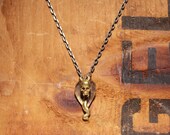 Skull necklace inspired by cobra snake skull made with brass from old bullets.