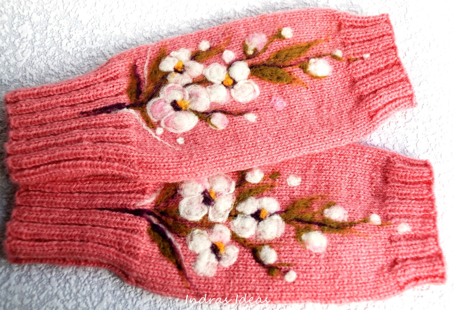 Pink fingerless gloves with felted flower.