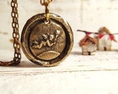 Bronze Cupid pendant in wax seal style