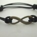Antique Gold Infinity Bracelet with Black Leather Cord