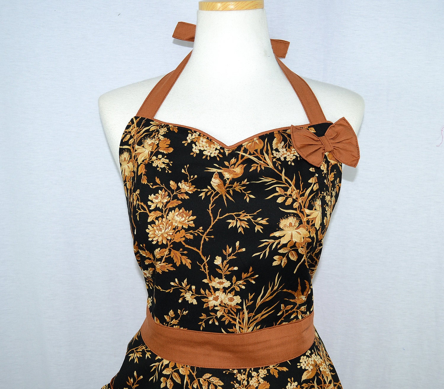 Birds on the tree in black apron