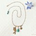 Turquoise gold charm necklace "Oceans Away" fish, shell, summer