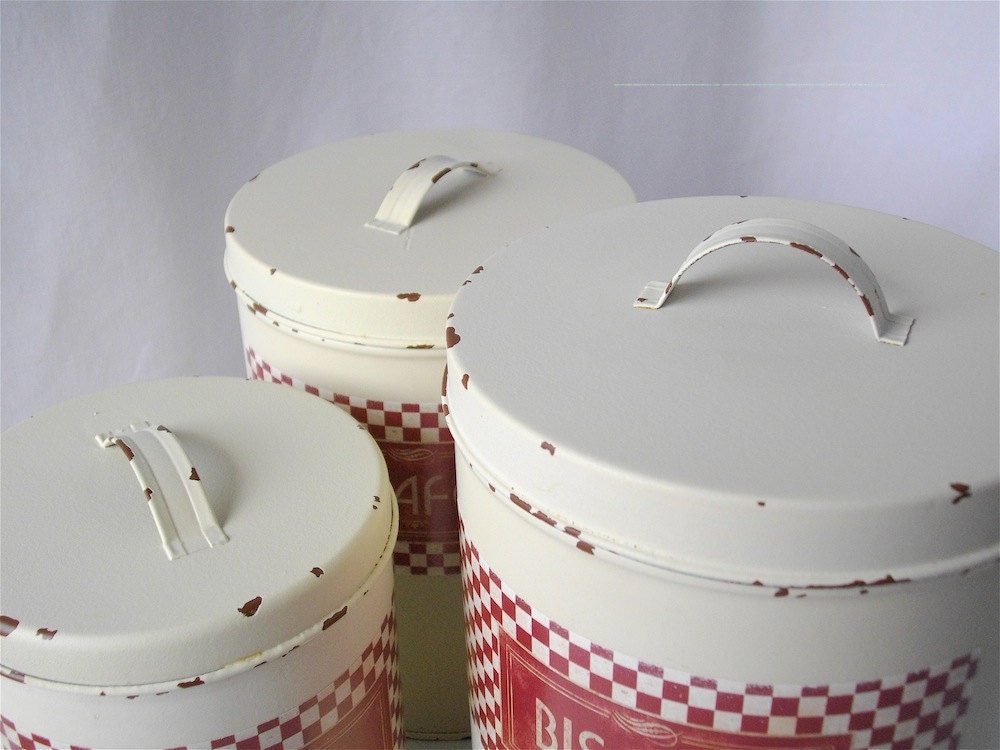 Vintage French white metal canisters.