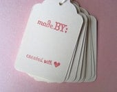Set of 10 stamped tags with string -- "made by"