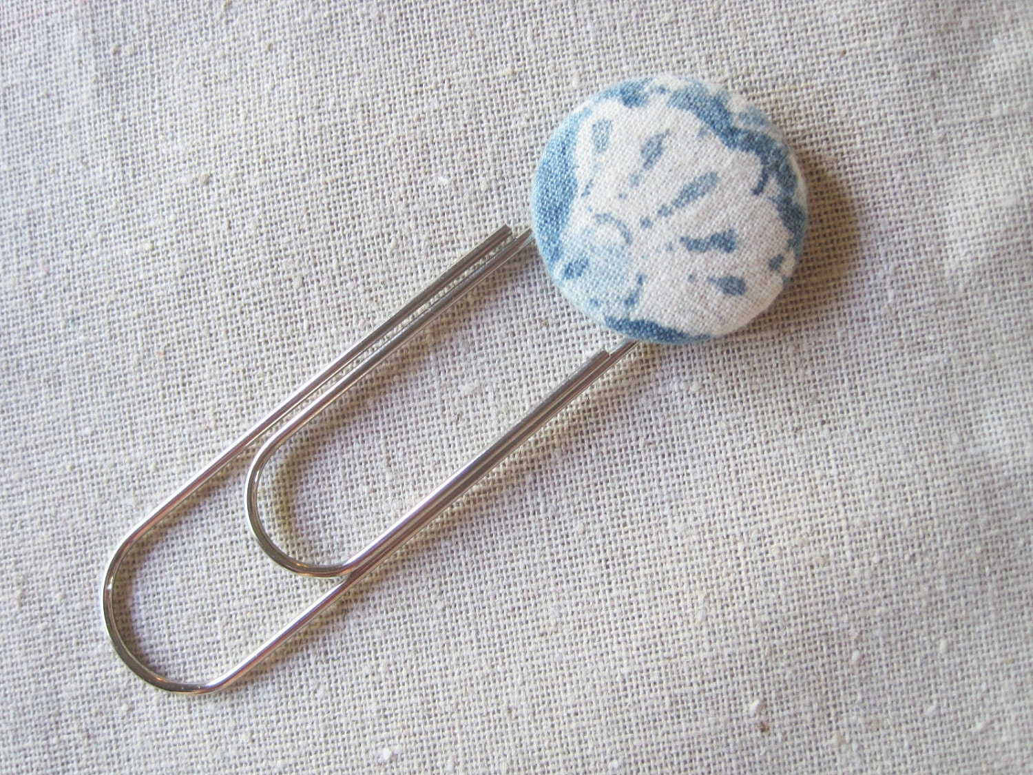 Bookmark -- oversize paperclip with white and light blue fabric button