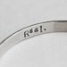 Hunger Games Real or Not Real hidden message cuff