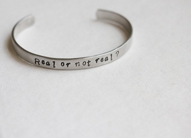 Hunger Games Real or Not Real hidden message cuff