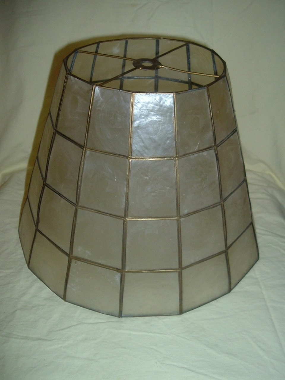 Vintage gold lamps with mother of pearl shades help with transformation