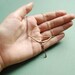 Golden bow and arrow necklace