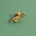 Pointing hand brass lapel pin