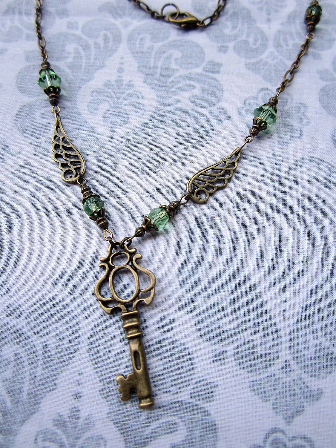 Winged Key  in Light Green and Antiqued Brass