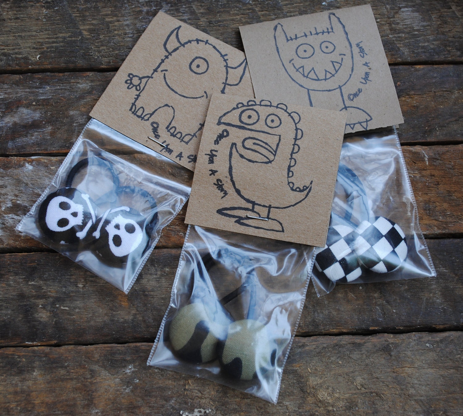 Fabric covered  button pony o's for the tomboy in skulls, camo and checks