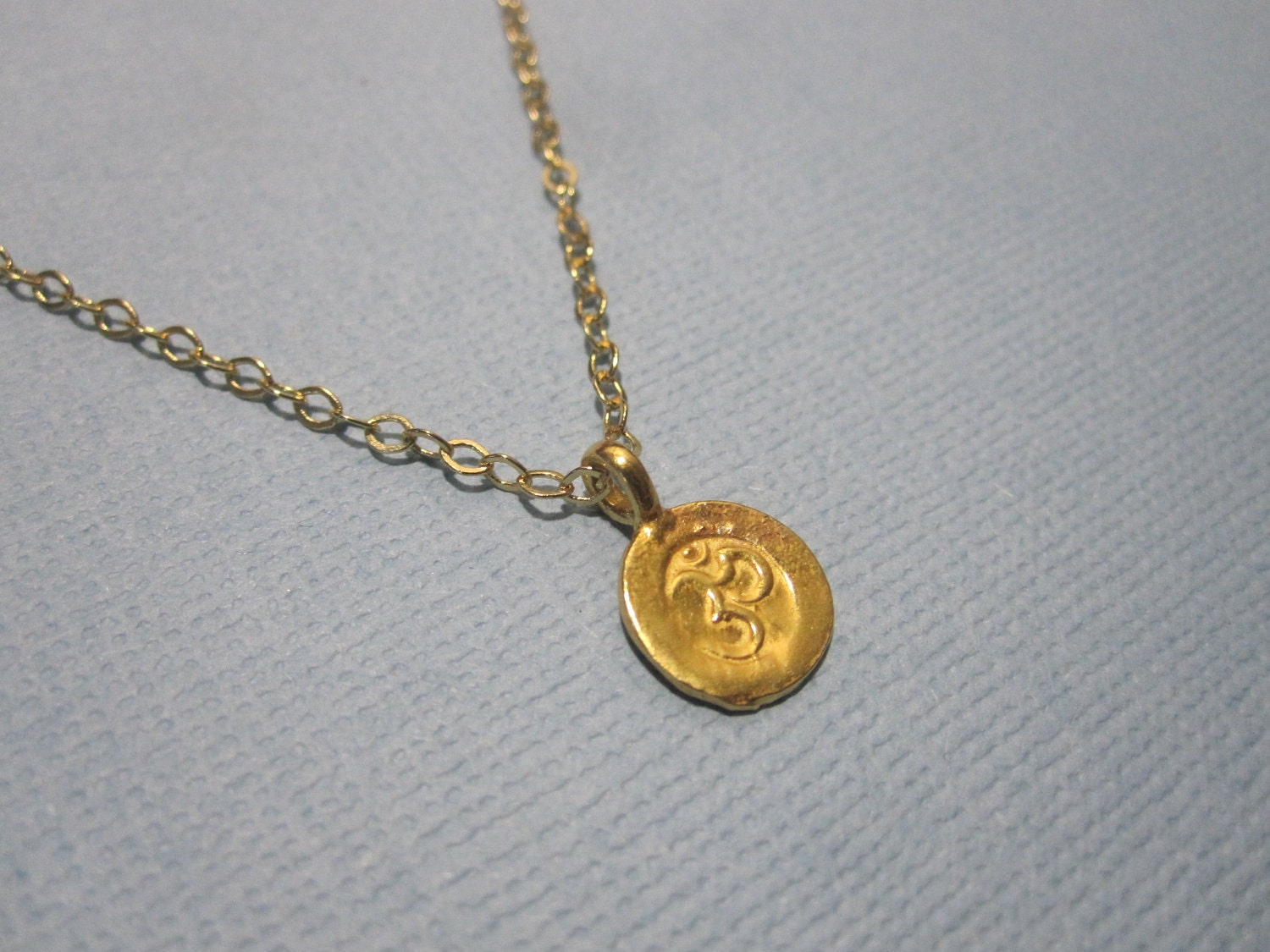 Tiny Sanskrit Om (Ohm) Necklace by MarisaLeeDesigns