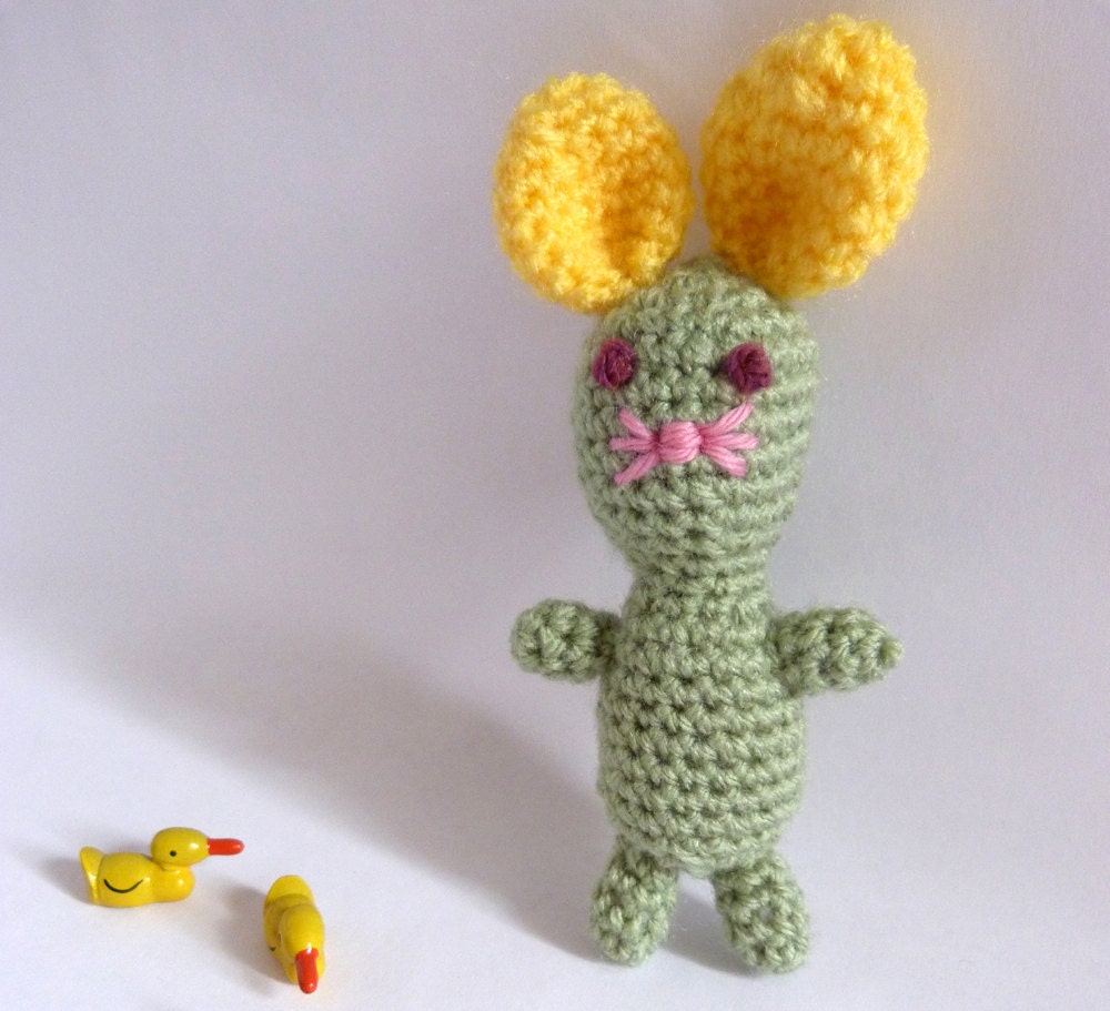 mentos. mint mouse boy with bright yellow ears. a brooch