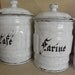 A serie of french white vintage enamel kitchen canisters. Cheaper shipping price in two parcels