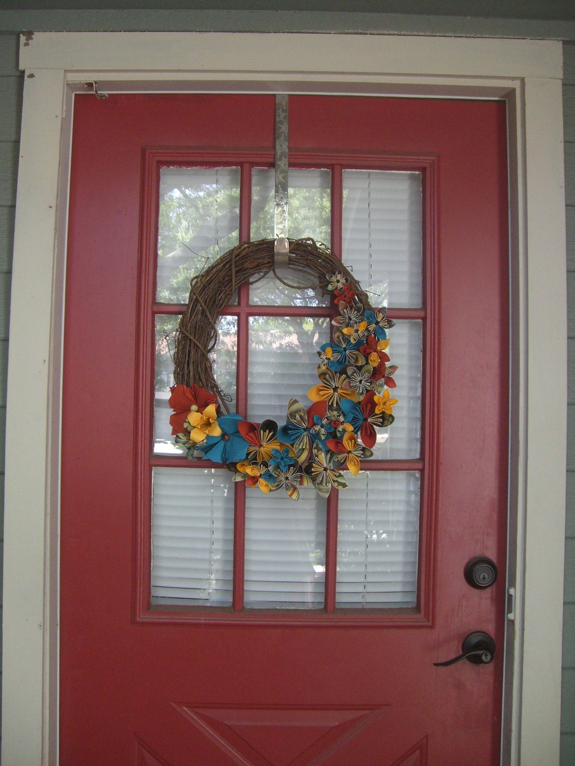Welcome- Wreath decorated with paper flowers