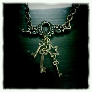 Through the keyhole - antiqued brass necklace with charms