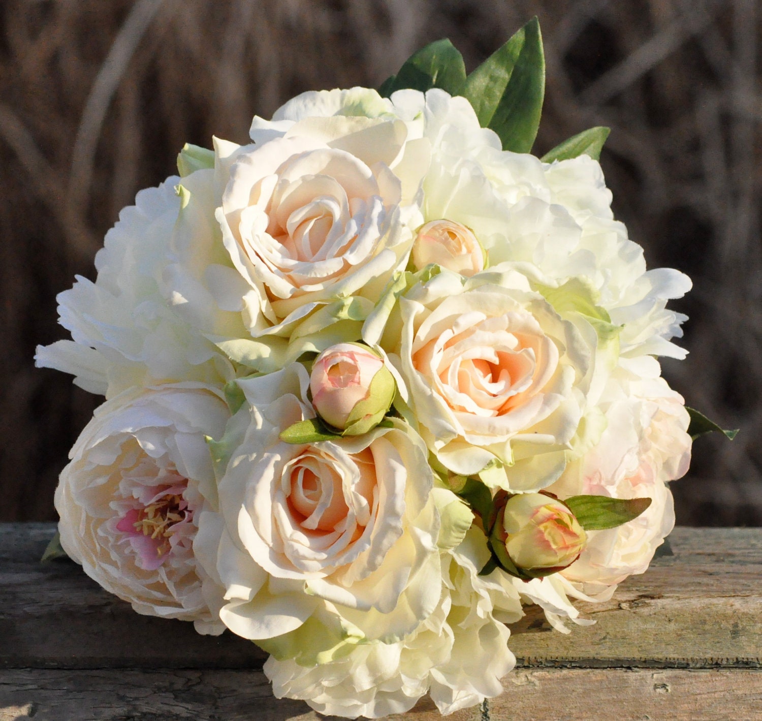Blush peony and rose wedding bouquet made of silk flowers.