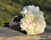 Blush roses and hydrangea wedding bouquet made of silk flowers.