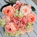Coral, salmon rose wedding bouquet.