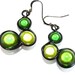 Wire wrapped earrings with bright green "Miracle Beads", black wire and french earwires.