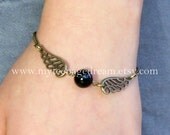 Harry potter Enchanted Golden Snitch ball black Ball with Double Sided brass Wings Bracelet