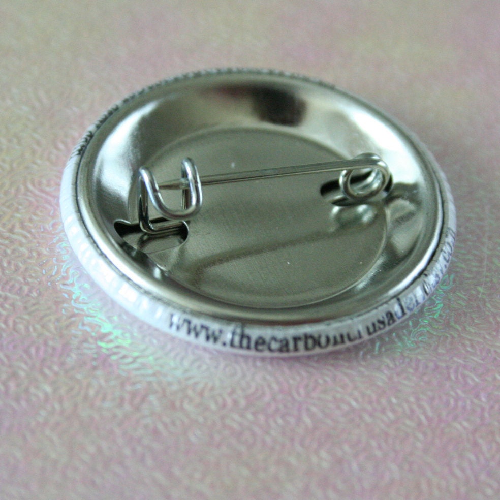does not play well with stupid people.  1.25 inch button. Your frustration is not your fault. You are surrounded by idiots.