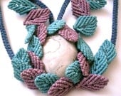 One of a kind macrame necklace with Chalcedony stone and blue and lila leaves.