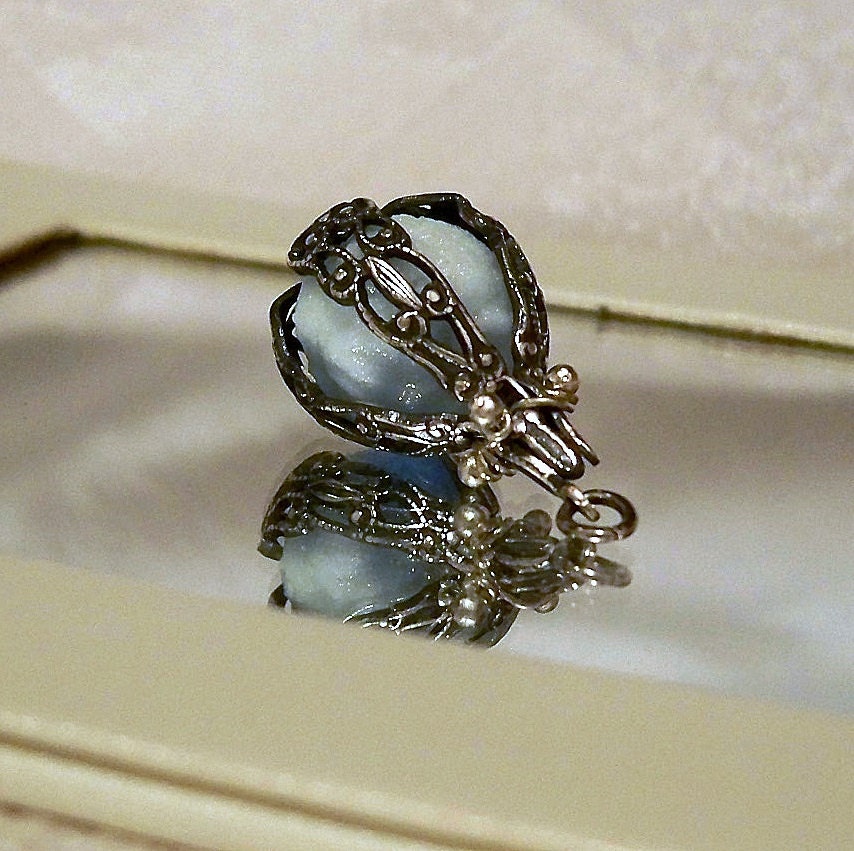 Mermaids Magic Ocean Blue - Caged Pendant with Glowing Essence of the Sea - Amazing Glow in the Dark Effects