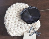 Crocheted hat with handmade navy flower