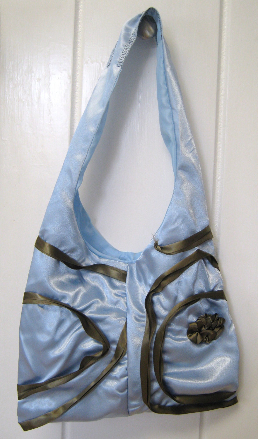 Sky blue satin shoulder purse with brown ribbon