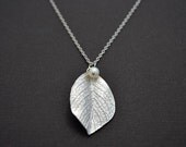 Leaf and pearl necklace.