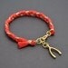 Coral red cotton braid bracelet
