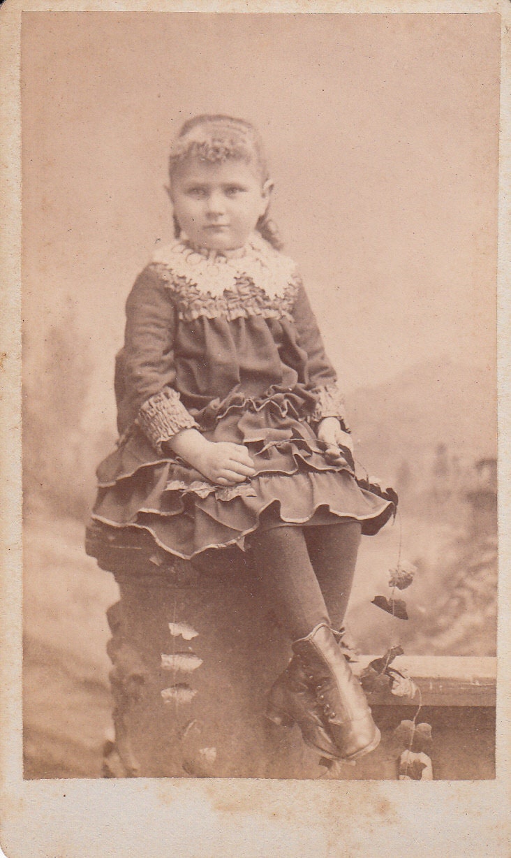 Vintage/Antique CDV photo of a girl in ruflled dress and curly hair