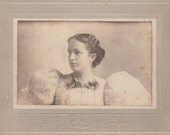 Vintage/Antique cabinet  photo of a woman in a dress with a wavy hair