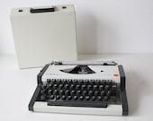 Vintage  1970s Olympia Traveller de Luxe Portable Manual Typewriter in white/grey color