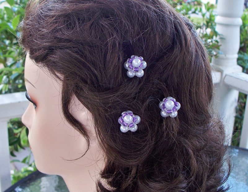 Bridal hair pins of white lustrous pearls and purple czech crystals.