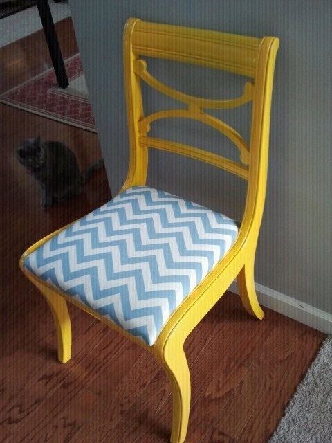 yellow gloss chair with blue and white chevron seat.