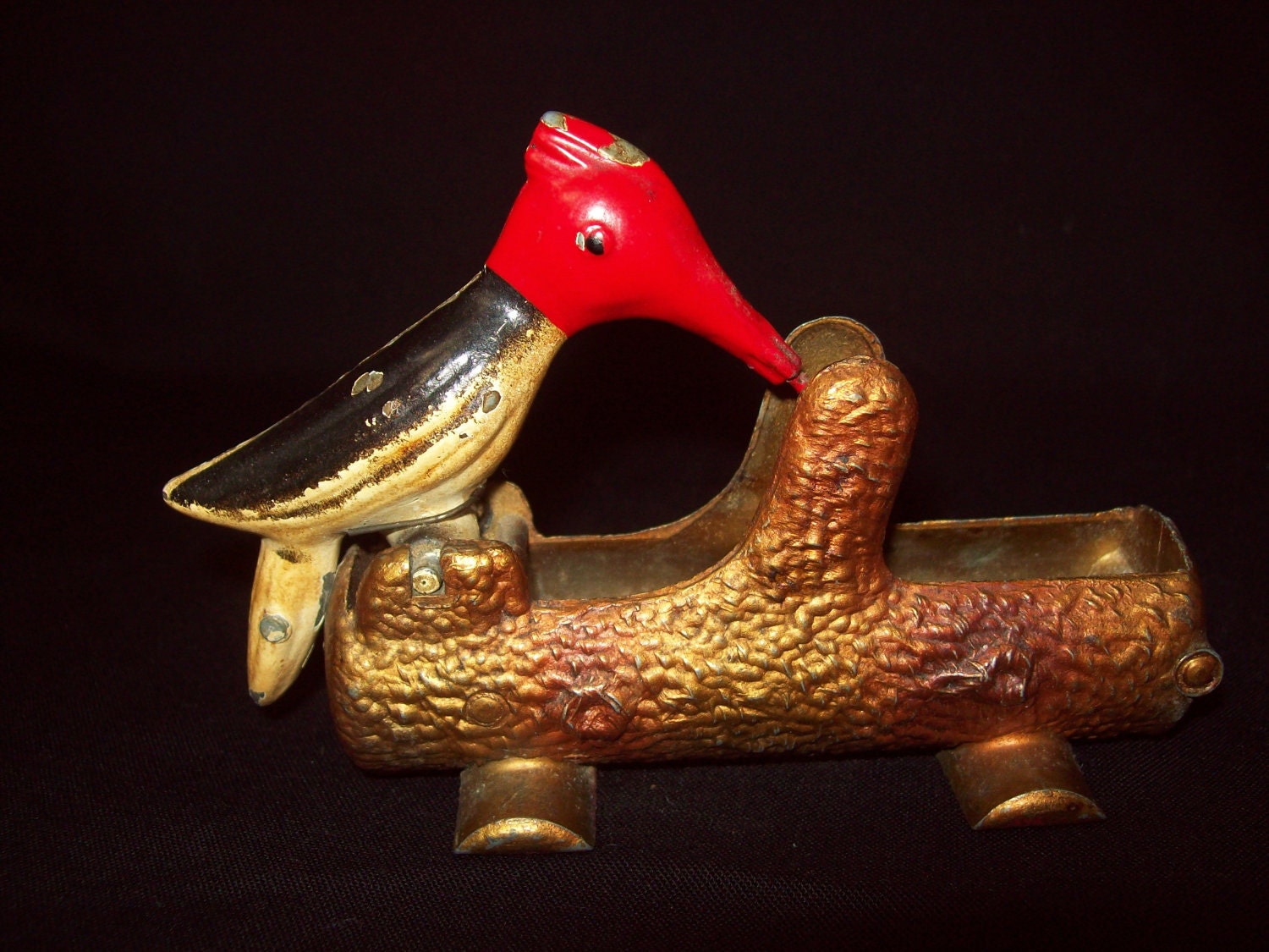 Antique cast iron woodpecker toothpick dispenser