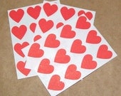 60 red heart stickers, 3/4 inch wide. in red