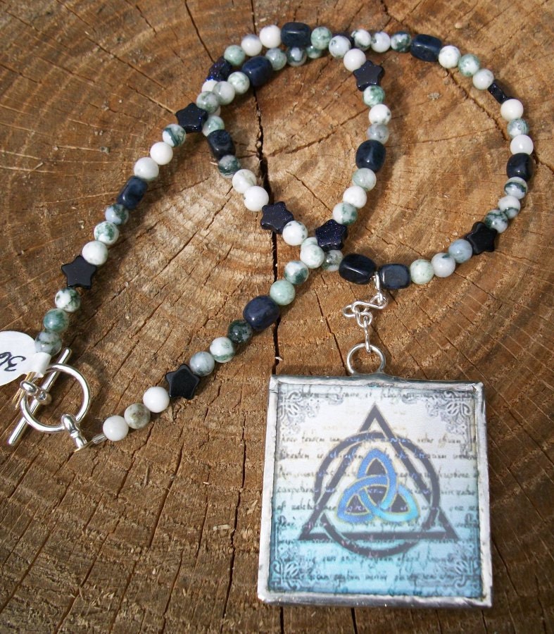 16 inch necklace with triquetra pendant, tree agate, dumortierite, and blue goldstone stars