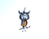 The Wise One, a sterling silver owl pendant.