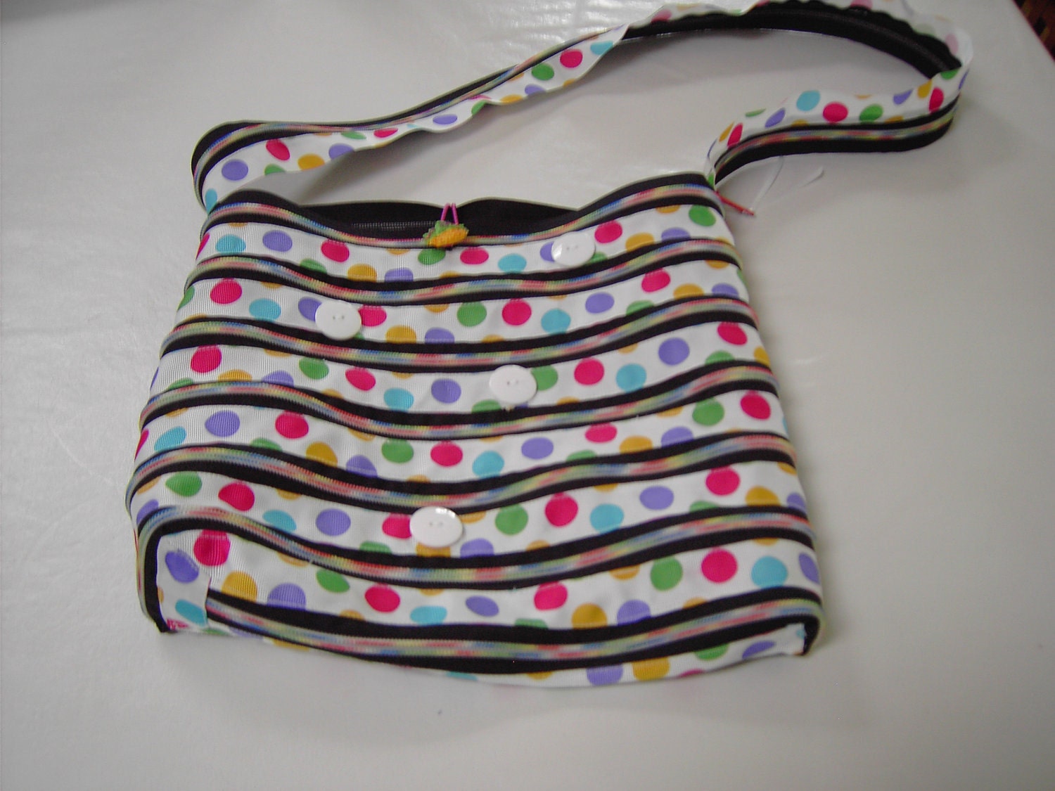Purse with Party Dots and White buttons with variagated zipper.